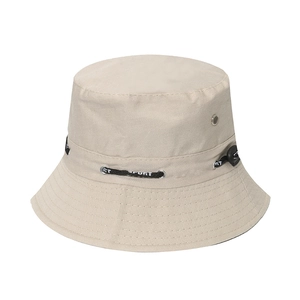 Detail of beige sun hat with metal eyelets and adjustable SPORT drawstring cord