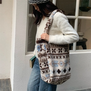 Detail of plush Fair Isle tote bag with geometric patterns for winter fashion