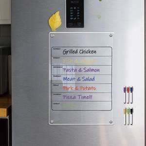 Magnetic clear acrylic weekly planner on fridge with six colorful dry erase markers