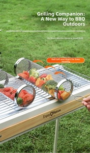Detail of a rolling stainless steel BBQ basket filled with vegetables on an outdoor grill