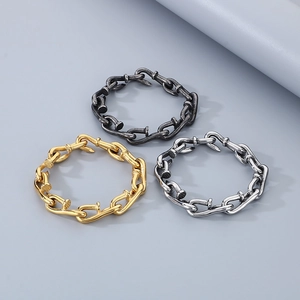 Detailed view of nail design chain bracelets in gold, silver, and antique black finishes