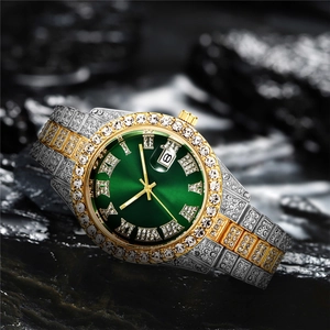 Macro shot of green sunray dial and iced-out diamond bezel on luxury steel watch