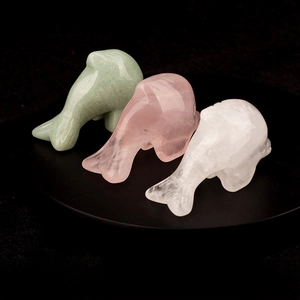 Detailed trio of polished natural gemstone whale figurines in green, pink, and white crystal