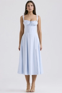 Detail of light blue floral midi dress featuring ruffled bust and side slit design