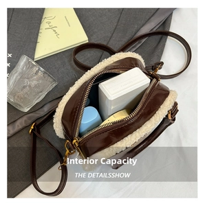Detail view of the interior capacity of a vintage faux shearling crossbody small bag