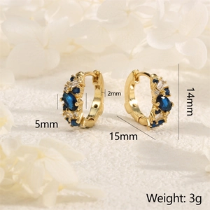 Detailed macro view of gold hoop earrings with blue marquise crystals and dimensions