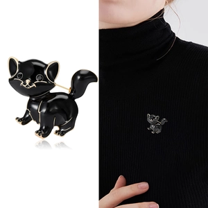 Vintage black enamel cat brooch with gold trim and rhinestones, main and lifestyle view