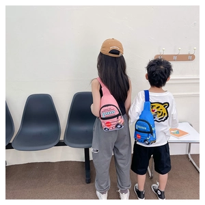 Rear view of pink and blue school bus chest bags on children with adjustable straps