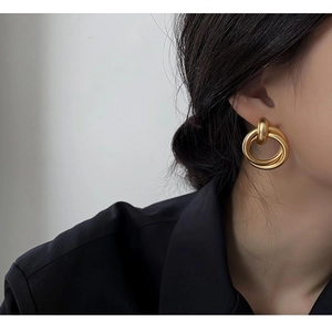 Matte gold triple interlocked geometric hoop earrings for women in minimalist style