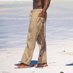 Detail of khaki men's casual beach trousers showing cotton linen texture and drawstring waist