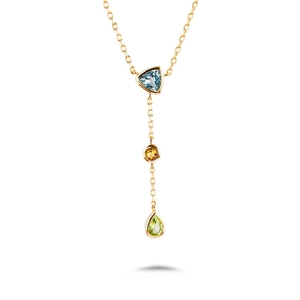 Macro shot of three-stone drop pendant with light blue, orange, and green gemstones
