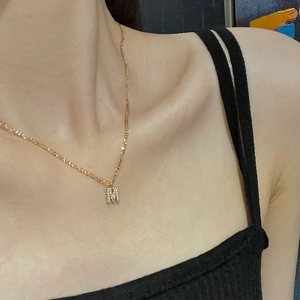 Minimalist gold Figaro necklace for women with a sparkling M letter pendant