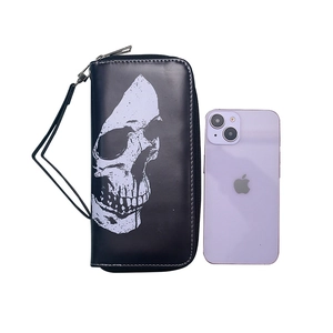 Vintage long zipper wallet with skull print shown next to a smartphone for size reference