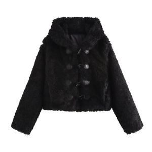Detail of black faux fur coat featuring classic horn button closure and textured fleece fabric