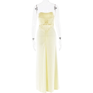 Detail of the light yellow tube dress showing backless cutout and lace-up ribbon design