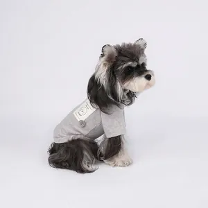 Grey knit cotton dog t-shirt with Stay Pawsitive patch on a Schnauzer dog model