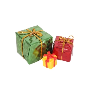 Set of three miniature Christmas gift box decorations in green, red, and yellow colors