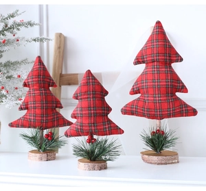Detailed view of red and green plaid fabric mini Christmas trees on natural wood bases