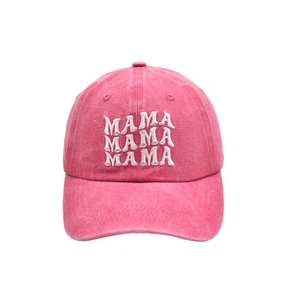 Close-up of triple MAMA white 3D embroidery on washed pink cotton baseball cap