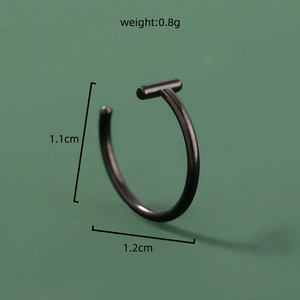 Macro shot of a black stainless steel U-shaped nose ring with detailed size measurements
