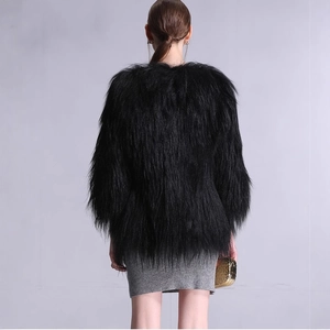 Elegant women's black faux fur long coat with fluffy texture shown from a back view