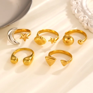 Five-piece gold adjustable ring set featuring moon, star and geometric droplet designs