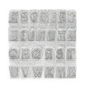Macro view of A-Z silver alloy heart charms with white rhinestones for 8mm DIY bracelets