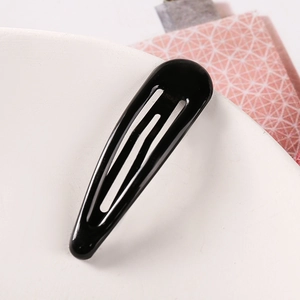Detailed close-up of a classic 5cm black water-drop metal BB hair clip with glossy finish