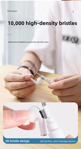 Detail of high-density brush cleaning fine dust from earphone speaker mesh ports