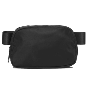 Detail of adjustable woven strap and smooth zipper on a black lightweight waterproof bag