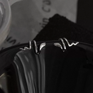 Polished silver snake ear cuff in a wrap-around design for a bold minimalist style