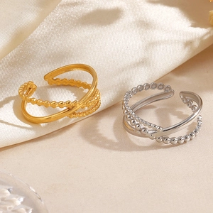Minimalist layered stainless steel rings in gold and silver finish with beaded textures