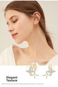 Detailed close-up of 925 sterling silver gold star stud earrings with zirconia stones