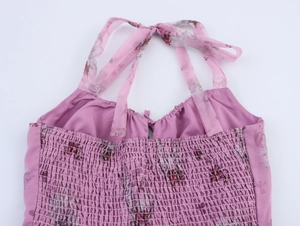 Detail of floral organza dress showing shirred elastic back and tie-up shoulder straps