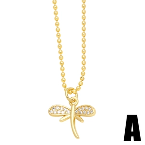 Minimalist gold dragonfly pendant necklace with white zircons on a delicate ball chain
