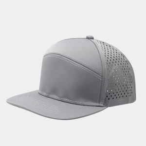Detail of laser-cut ventilation holes on grey flat brim baseball cap for outdoor breathability