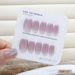 Handmade light purple cat-eye press-on nails in square oval shape on display card