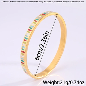Detail view of titanium steel bangle showing 6cm diameter size and colorful enamel dots