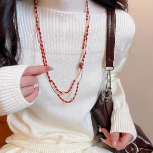 Double-layered beaded necklace with red oval stones and golden hollow accents for women