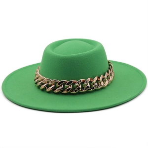 Detailed top view of a bright green wool felt fedora with a bold gold chain link band