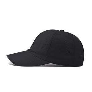 Detail of breathable mesh fabric on black quick-dry outdoor sun hat for hiking