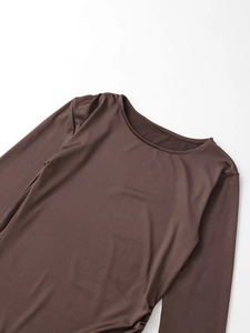 Detail view of dark coffee long sleeve tee with ruched waist and soft elastic texture