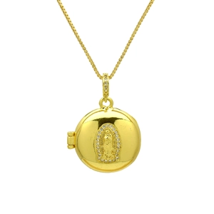 Detailed close-up of a gold round locket necklace featuring a religious relief and zircons
