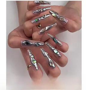 Detail of long coffin nails with liquid metal texture and inlaid abalone shell fragments