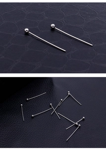 Close-up of silver stainless steel ball head pins for DIY jewelry and earring making
