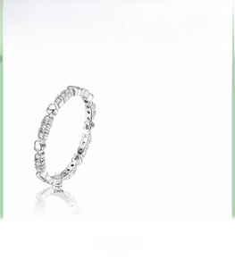 Macro shot of S925 sterling silver heart ring featuring cubic zirconia and polished finish