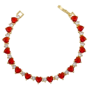 Elegant gold-tone heart bracelet featuring red heart-shaped stones and micro-pave zircons