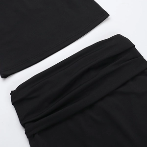 Detailed macro view of black knitted fabric texture on the two-piece set waistband