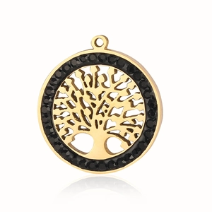 Macro detail of a golden Tree of Life pendant featuring a black rhinestone halo setting