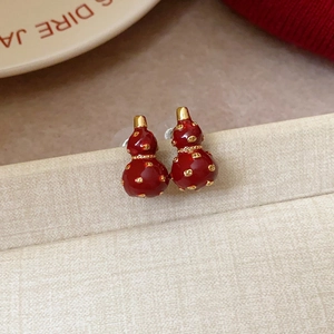 Gourd shaped red enamel earrings with golden accents and silver needle posts
